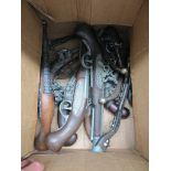 A box of replica pistols