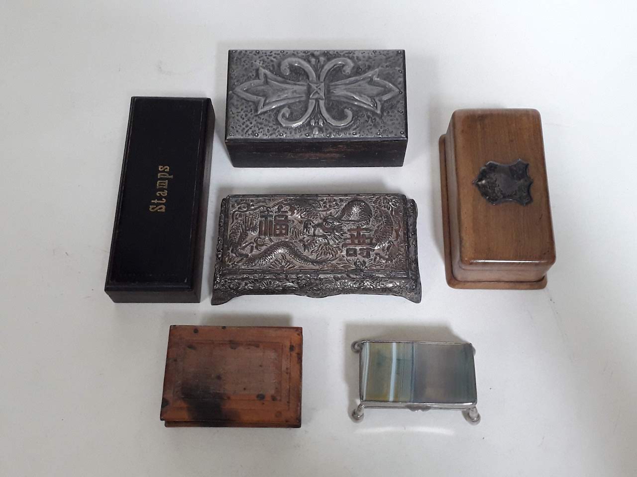A collection of stamp boxes including agate,