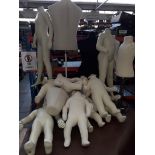 A collection of child sized mannequins