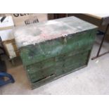 A large wooden tool chest with drawers and tools