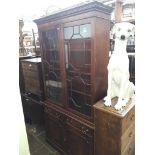 A mahogany glazed cabinet bookcase