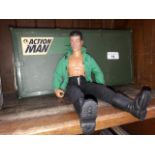 An Action Man figure in plastic box, with sub machine gun