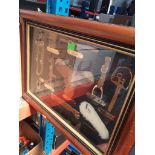 2 glaxed display cases, one with cut throat razors etc and one with horse tack