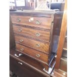 A 19th century and later mahogany chest of four drawers of small proprtions