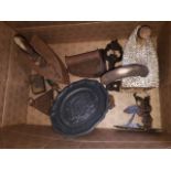 A box of old irons and other small metalware
