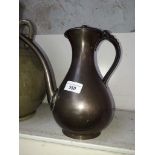 A Japanese bronze coffee pot, three character marks to handle, height 25cm.