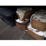 Four suitcases and four wicker baskets of linen and lace