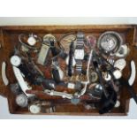 A tray of watches and pocket watches