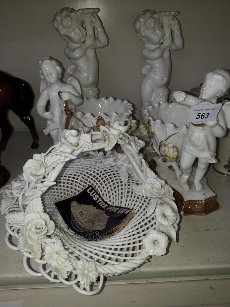 Two pairs of Continental porcelain figures and a basket