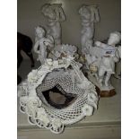 Two pairs of Continental porcelain figures and a basket
