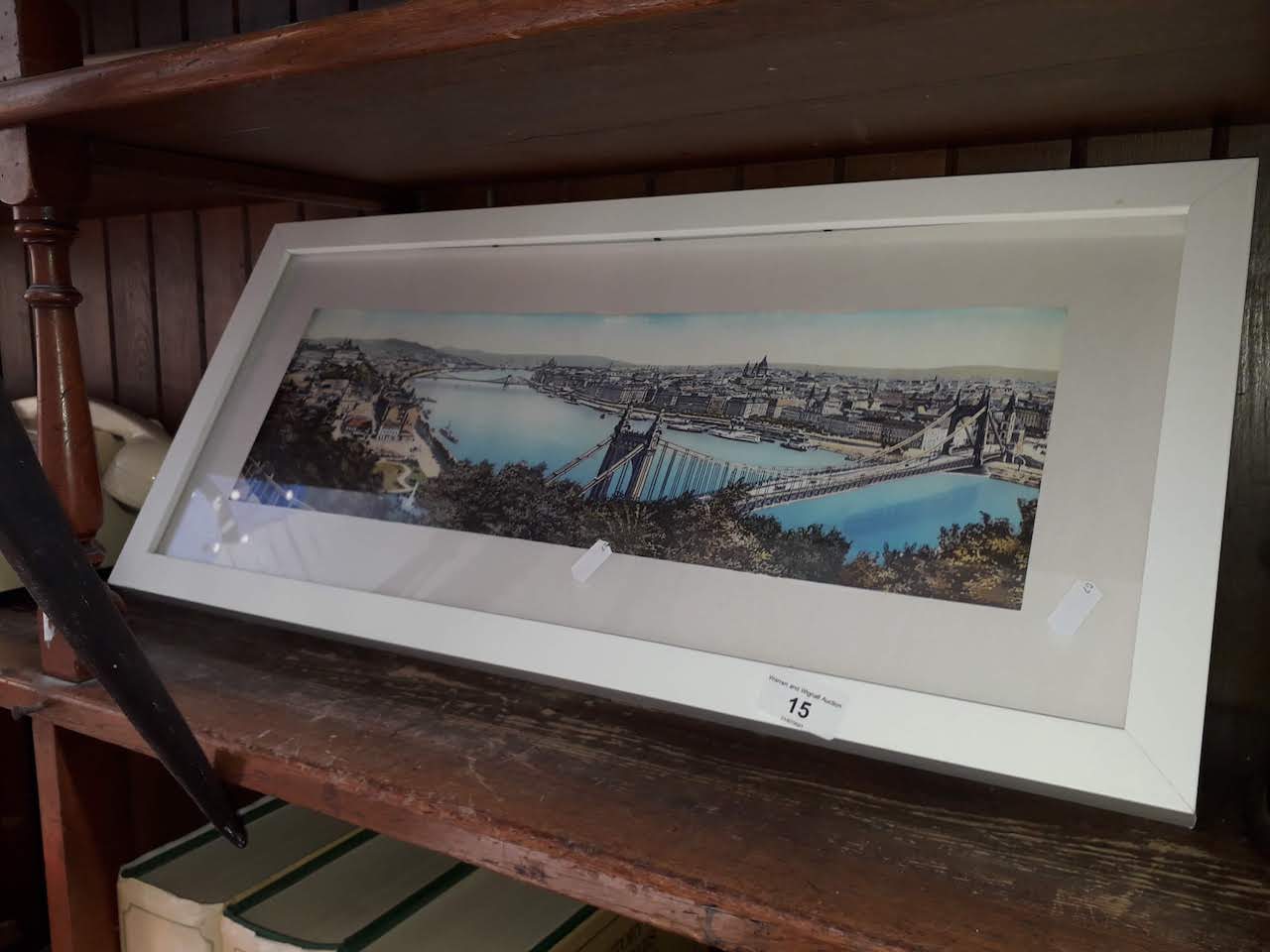 A framed print of a river scene