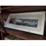 A framed print of a river scene