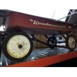 A vintage Roadmaster childrens pull along cart