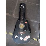 A Westfield acoustic guitar LA125BK with a TGI padded soft case