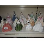 Fourteen Coalport figures