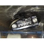 An old classic car radio with wires and speakers