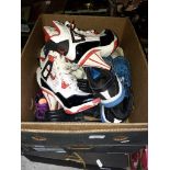 Two boxes of mainly childrens shoes, boots, trainers, etc.