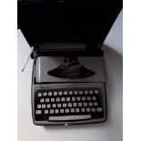 A Remington Envoy portable typewriter in hard case