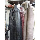 A Burberry raincoat - appears large size. A sheepskin coat size 18; A Modern Classics ladies jacket,