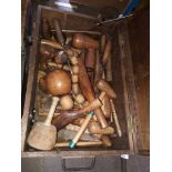A wooden toolbox containing lead working tools including mallets etc