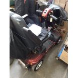 A Shoprider mobility scooter with key and charger