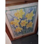 A large framed print featuring daffodils