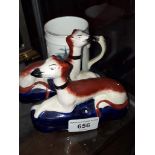 Pair of small reproduction Staffordshire greyhouds and an 1883 mug