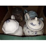 A box with four tea pots