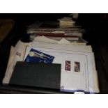 A crate of stamp albums and album pages