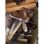 A box of wood working tools and a blowlamp