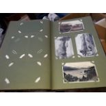 A large antique postcard albums with approx 100 postcards 1900-1940s including RP cards