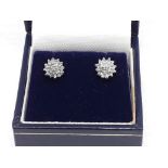 A pair of diamond stud earrings, marked '375', gross wt. 1.57g.