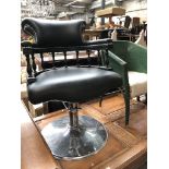 A captains style hydraulic barbers chair