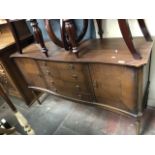 A reproduction mahogany sideboard.