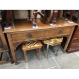A single drawer mahogany sideboard on tapered legs