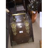 A coal bucket complete with shovel, having brass hinges and handle and a copper bucket with fireside