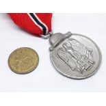 A German WWII Eastern Front medal and coin.