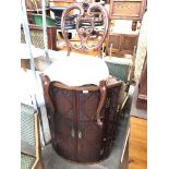 A carved corner cabinet and a chair