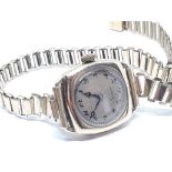 A ladies hallmarked 9ct gold wristwatch with gold plated strap.