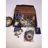 A small case of small collectables including costume jewellery, guide and other badges, etc.