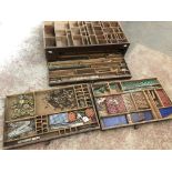 A wooden box of vintage Meccano parts