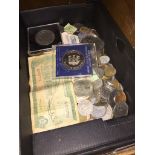 A box of world coins and banknotes