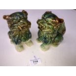 A pair of pottery Foh dogs