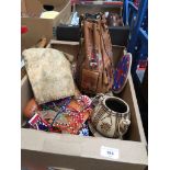 A box of misc bags, handbags and purses to include beaded and leather.