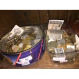 Two tins of world coins and bank notes