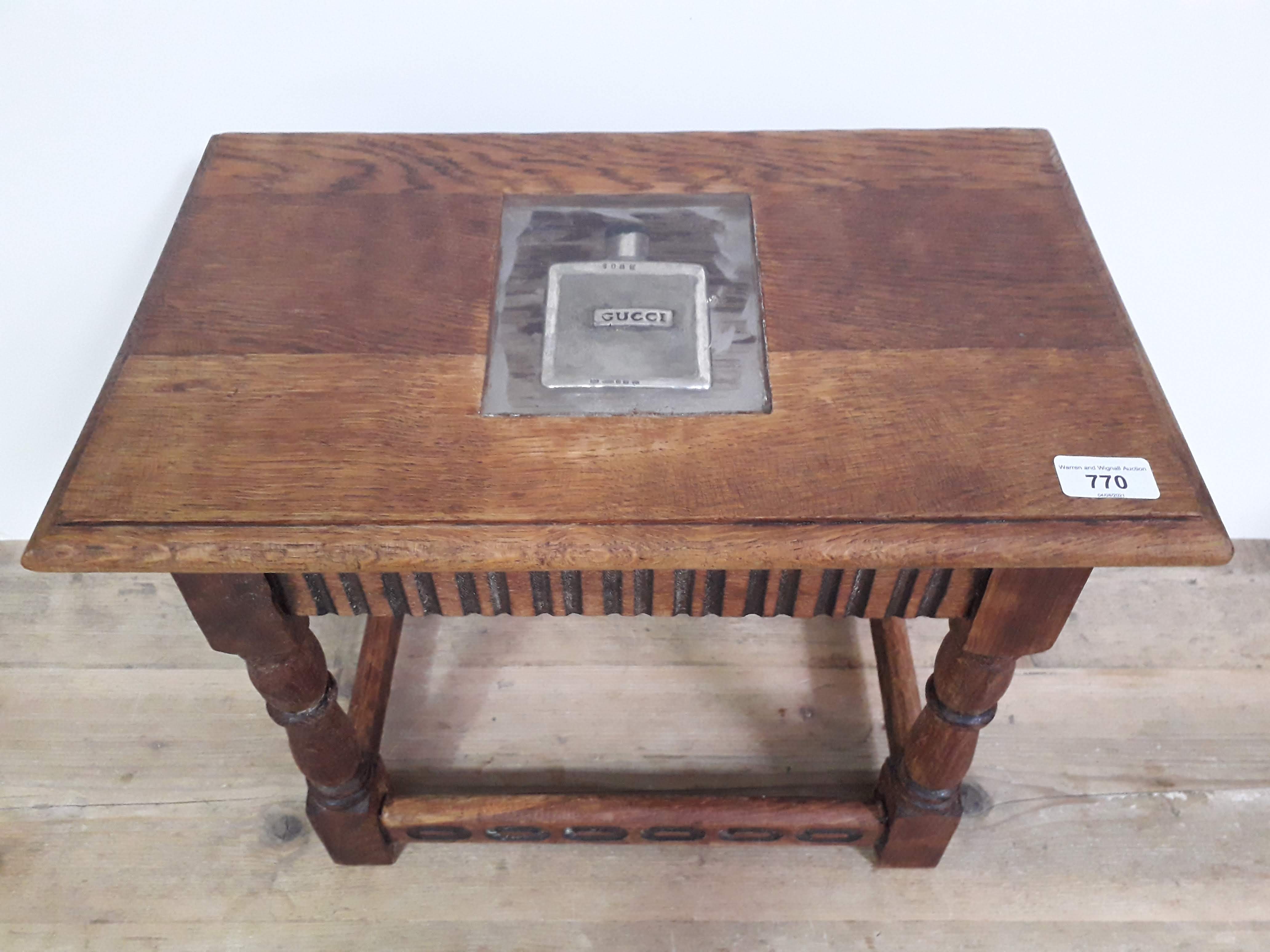 A contemporary Arts & Crafts rustic stool/table with resin slab set with hallmarked silver