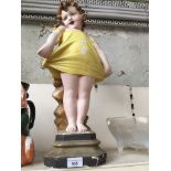 A 1930's Art Deco gesso figure of a girl.