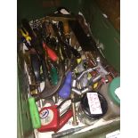 A green tray of misc tools