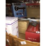 A box of boxed items to include Roberts portable radio, flexi desk lamp, jigsaw rolls, hair dryer,