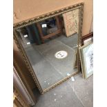 A bevelled mirror approx 98 x 68 cm